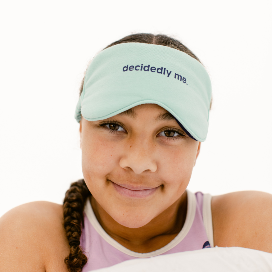 The Decided Collection DreamScape Sleep Mask. Made from the same signature soft fabric as our pajamas, this sleep mask is as cozy as it is functional. Designed to keep the darkness in and light out, it helps her drift off faster and stay asleep longer.